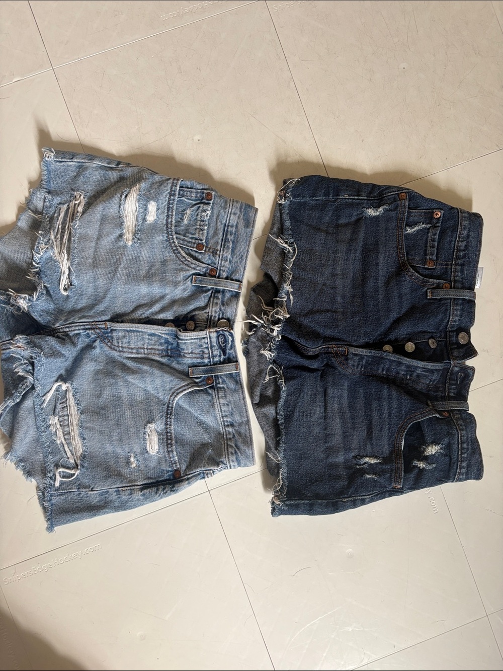 Levi's Distressed Denim Jean Shorts in Light Blue and Dark Blue